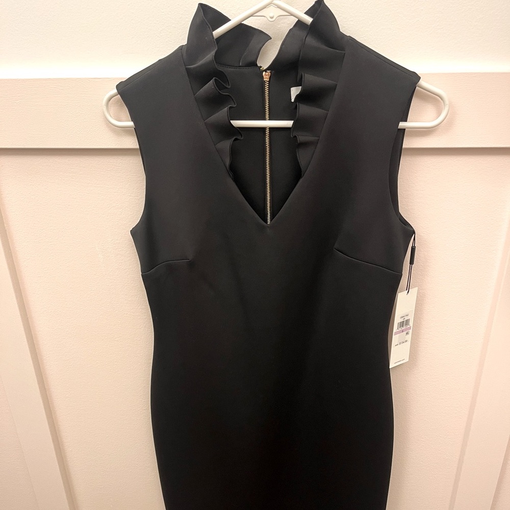 Black Calvin Klein dress size 6, gold exposed zipper in the back. Tags on